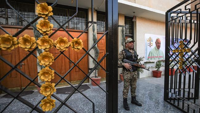 A policeman stands guard outside the Chaldean Catholic Church of St. Joseph in Baghdad on ahead of Pope Francis's visit. Picture: AFP