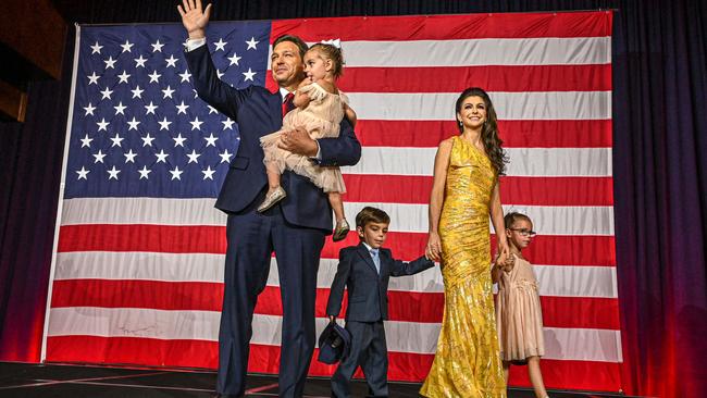 Ron DeSantis with his wife Casey DeSantis and children Madison, Mason and Mamie, waves to the crowd during an election night watch party at the Convention Center in Tampa. Picture: AFP.