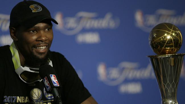 Golden State Warriors forward Kevin Durant speaks at a news conference.
