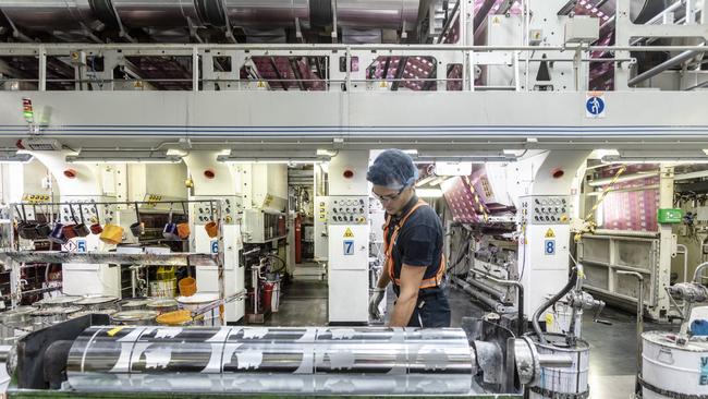 An operator sets up a printing machine inside an Amcor packaging plant in Lugo di Vicenza, Italy. Picture: Getty Images