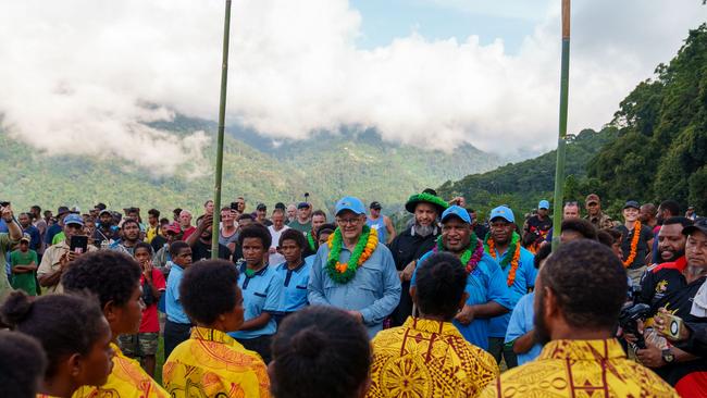 The prime ministers were greeted by locals while walking the track. Picture: PMO