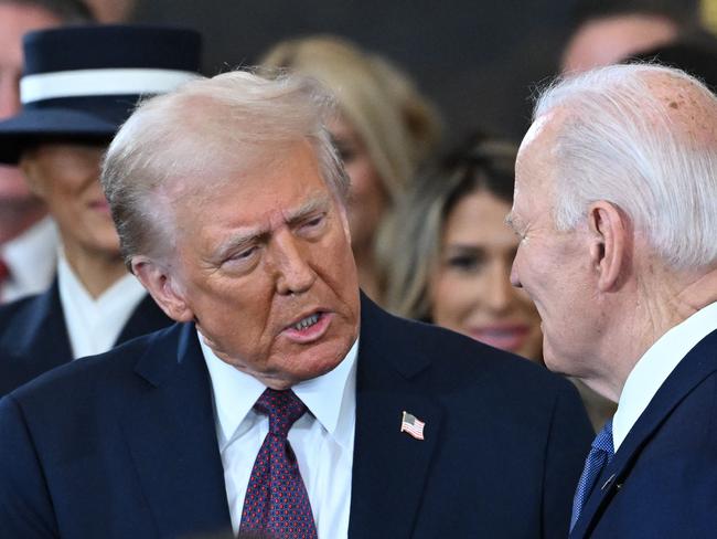 US President Joe Biden looks on as US President-elect Donald Trump arrives during the inauguration ceremony before  Trump is sworn in as the 47th US President in the US Capitol Rotunda in Washington, DC, on January 20, 2025. (Photo by SAUL LOEB / POOL / AFP)