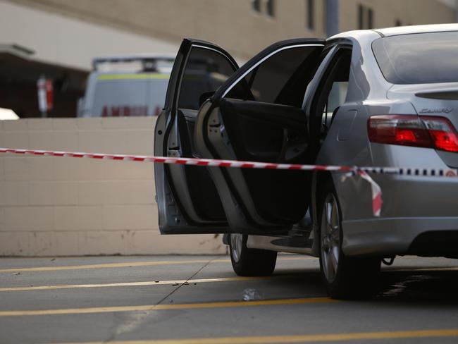 There was blood on the door and bullets strewn on the ground next to this car that was abandoned at the hospital after the men were dropped off.