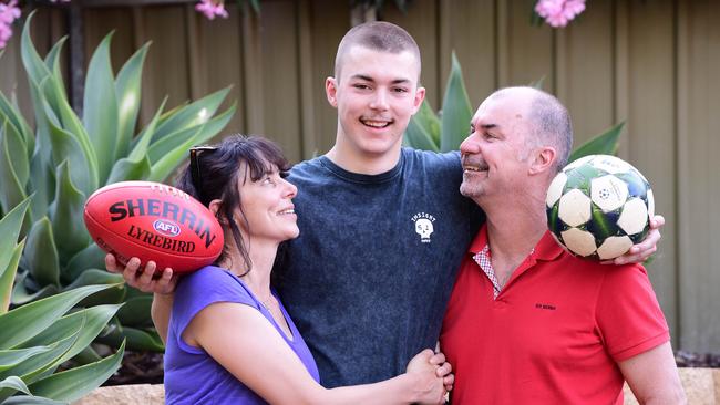 South Adelaide’s Sam Draper, pictured with his parents Jo and Martin, was taken by Essendon in the rookie draft – nine months after switching from soccer to football. Picture: Campbell Brodie.