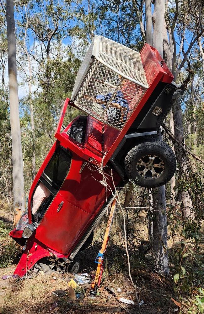 One person has been airlifted in a critical condition from the scene of a dramatic crash north of Gympie where a ute was left suspended in trees on the side of a road. Picture: Clayton's Towing