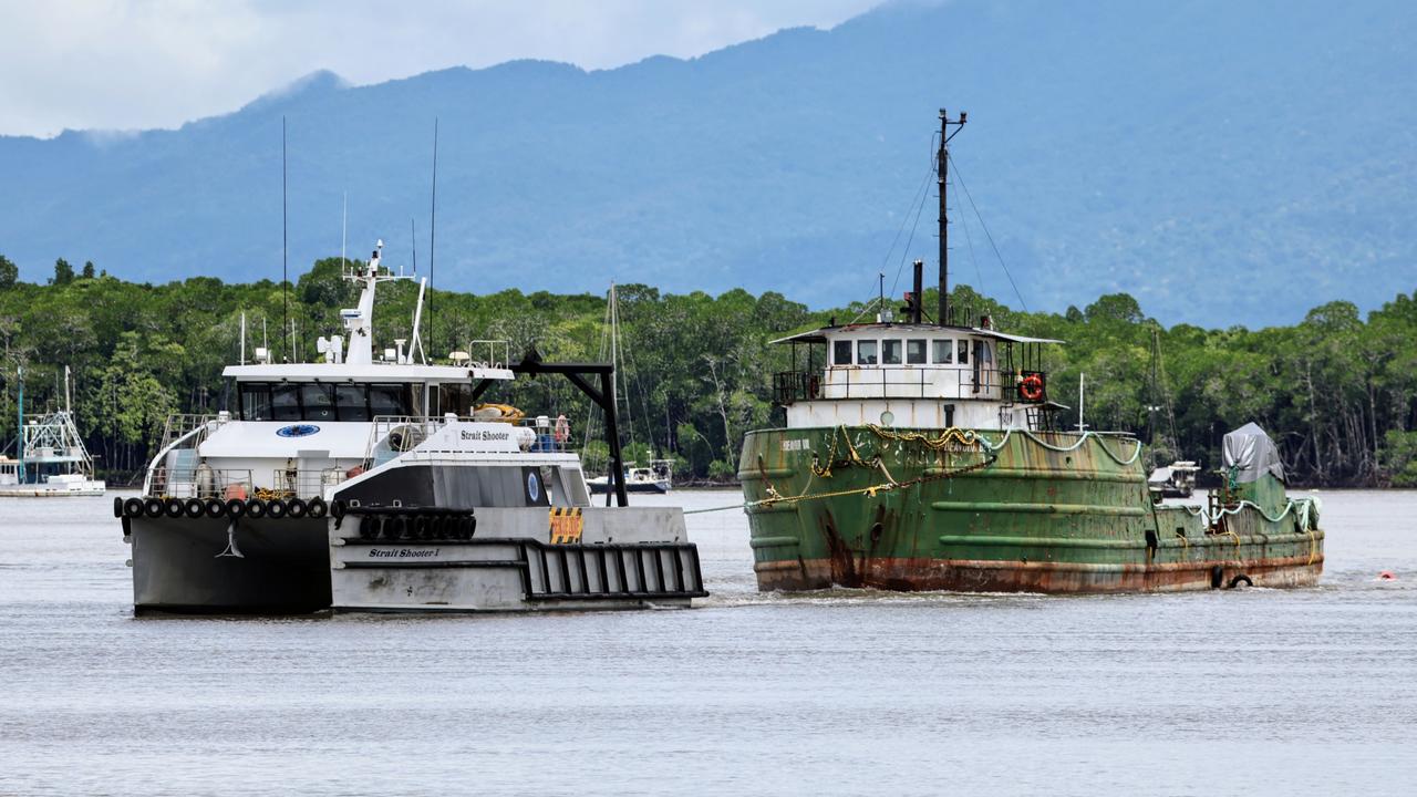 Carpentaria Contracting vessel Strait Shooter tows the Endeavour Bay from Trinity Inlet and tows it to the Coral Sea, towards Papua New Guinea. Picture: Brendan Radke