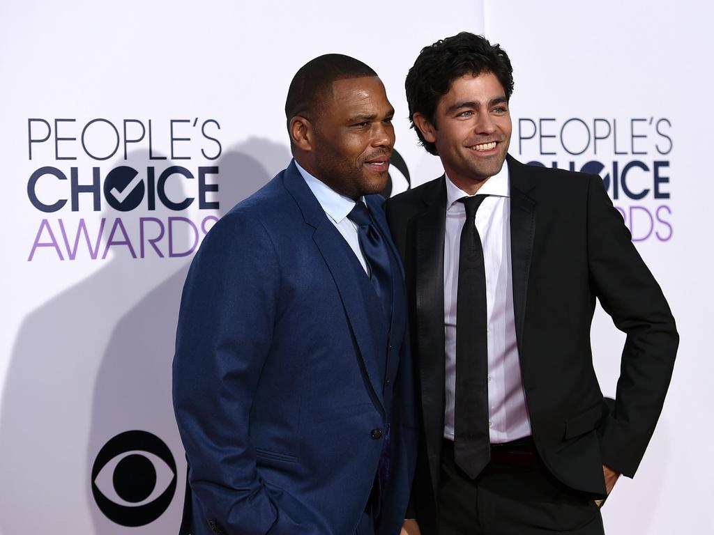 Anthony Anderson, left, and Adrian Grenier arrive at the People’s Choice Awards. Picture: AP