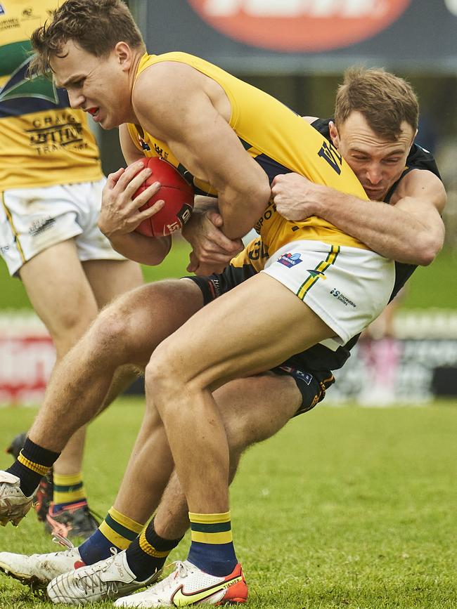 Glenelg’s Jack Yates applies a strong tackle on Woodville-West Torrens’ Dylan Clarke in the Tigers’ convincing win at the Bay. Picture: Matt Loxton