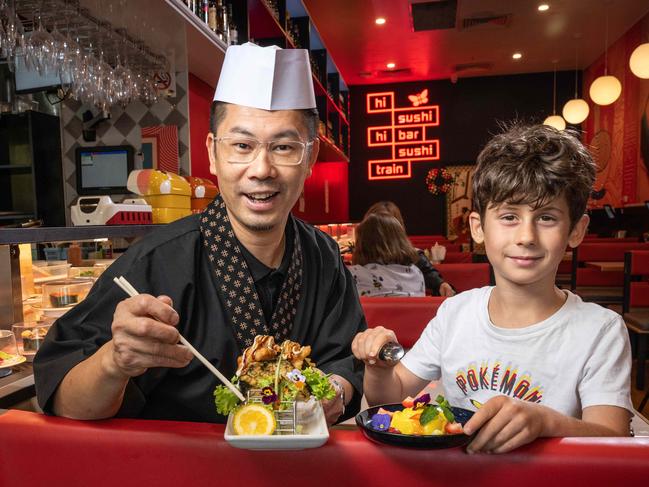 22-01-2024 Head Chef Leslie Chan and customer Ramon La Torre at the new Hi Sushi complete with Geelong's first sushi train. Picture: Brad Fleet