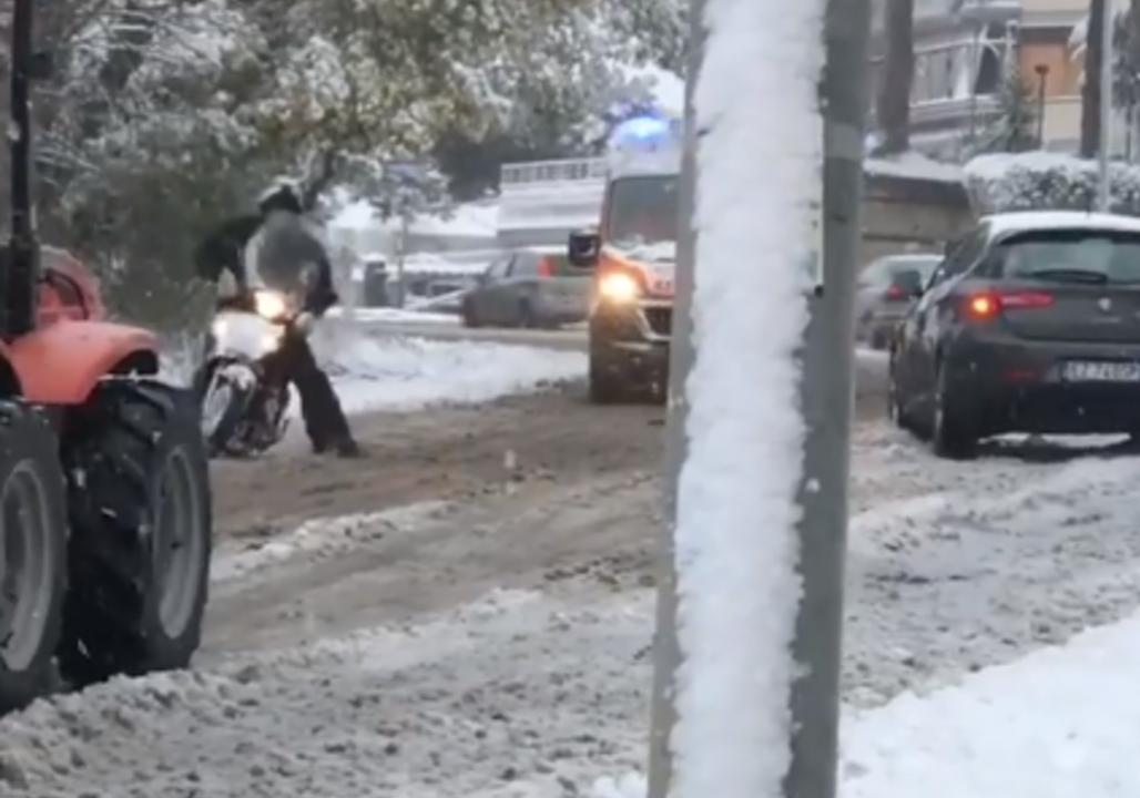 Slow Is Not Steady for This Moped Rider on Rome's Sludgy Streets