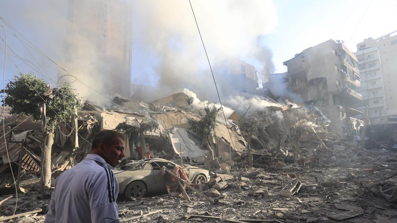 A man walks amid the rubble of a building levelled in an overnight Israeli airstrike that targeted the neighbourhood of Moawwad in Beirut's southern suburbs on October 3, 2024. Picture: AFP.