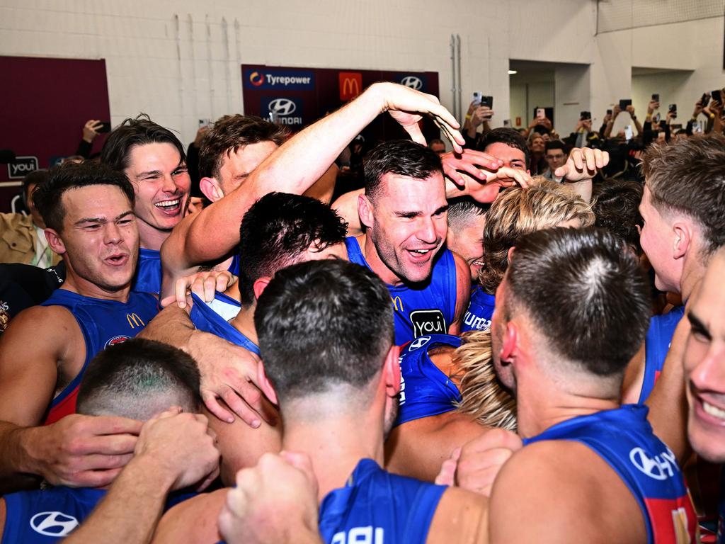 Jack Payne (centre) celebrates with his Brisbane teammates after the Lions’ preliminary final win over Geelong. Picture: Quinn Rooney/Getty Images