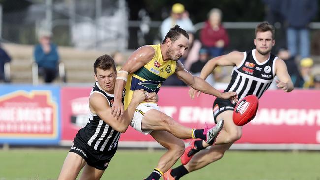 Jack Trengove tackles Eagle James Boyd while playing for the Magpies in the SANFL. Picture: Sarah Reed