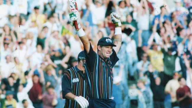 Jones salutes his home crowd after reaching 100 for the World XI against Australia in 1996.