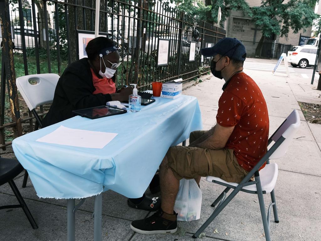 A city run vaccination site stands in a Brooklyn neighbourhood which is witnessing a rise in Covid-19 cases. Unvaccinated residents will be paid $US100 a jab. Picture: Getty Images/AFP