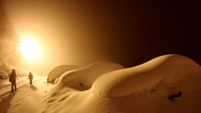 Cars covered in snow at Falls Creek ski resort in Victoria on Sunday. Picture: Chris Hocking