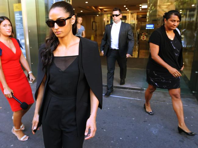 Jessica Peris leaves court yesterday where she was supported by her mum Nova Peris (right) and Nova's husband Scott Appleton (behind, centre). Picture: Rohan Kelly