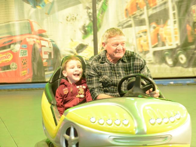 Mylo Meddings had nothing but smiles for a ride on the dodgems with grandfather Keith Louk at the Charters Towers Show. Picture: Trudy Brown