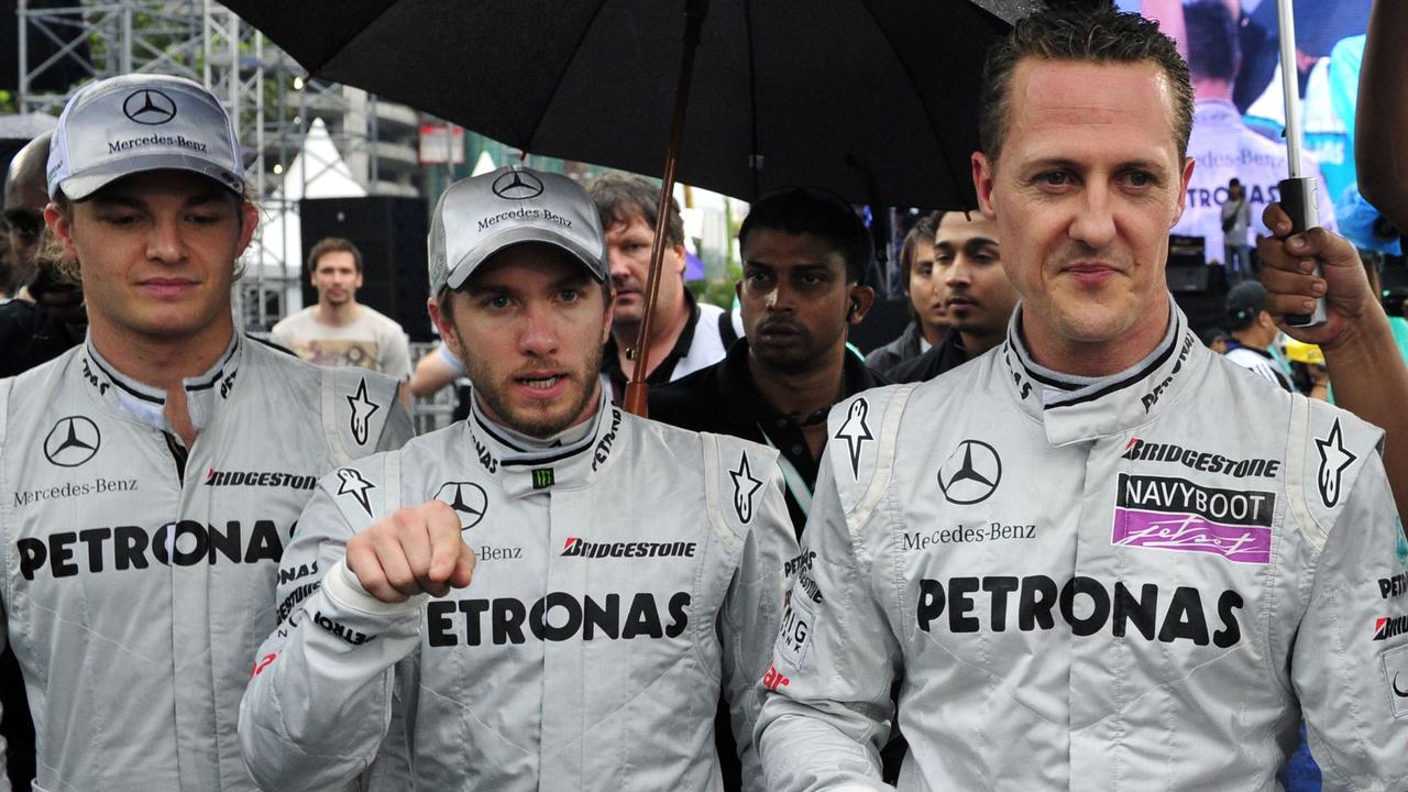 Nico Rosberg, Nick Heidfeld and Michael Schumacher. AFP PHOTO / SAEED KHAN