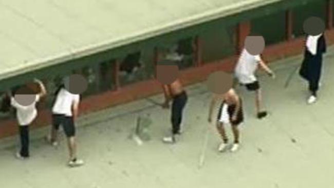 Youths on the roof of the Melbourne Youth corrections Centre in Parkville today. NINE News stills