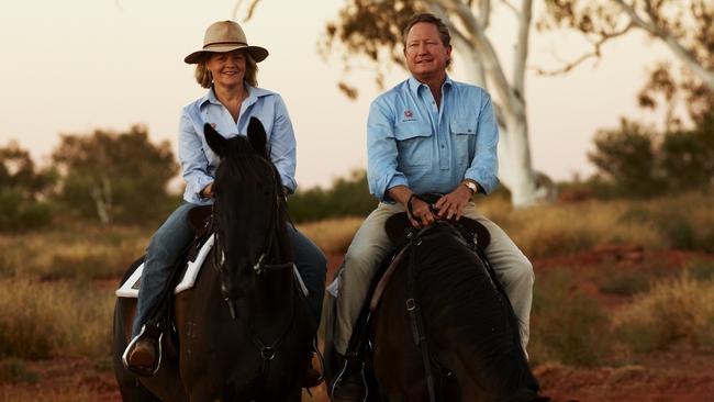 Twiggy Forrest and his wife Nicola riding horses while wearing R.M. Williams gear.