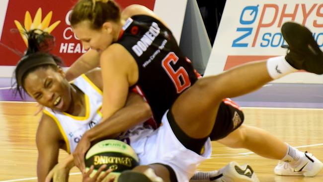 Melbourne Boomers' Lindsay Allen scraps with Townsville Fire's Mikhaela Donnelly. Picture: Evan Morgan