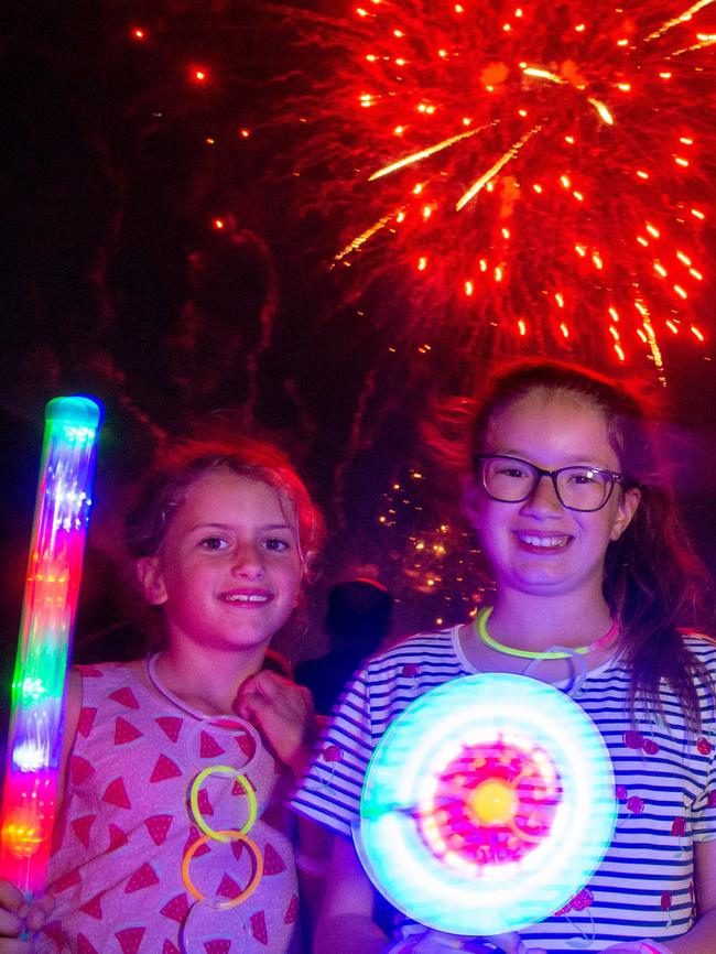 . Ava (8) and Erica (9) enjoy the fireworks at Yarra Park. Picture: Jay Town