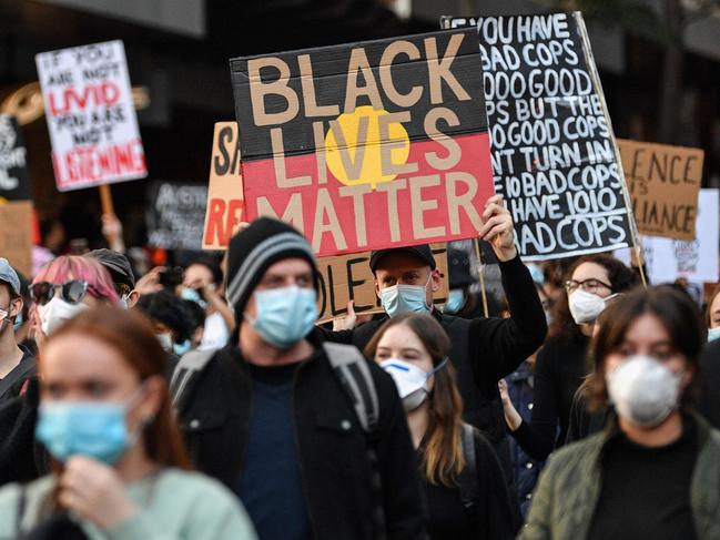 Demonstrators attend a Black Lives Matter protest to express solidarity with US protestors in Sydney on June 6, 2020 and demand an end to frequent Aboriginal deaths in custody in Australia. (Photo by SAEED KHAN / AFP)