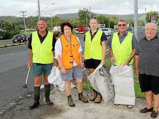 TIDY TOWN: The Withcott Litter Patrol works hard each week to ensure their town does not get the same dirty title as the rest of the state. Pictured are John Bennett, Cr Janice Holstein, Kate Thornton, Eric Canning, and Neil Simpson of the Withcott Hotel. Picture: Tom Threadingham