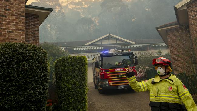 Firefighters prepare to evacuate a residential aware. Picture: NewsWire / Jeremy Piper