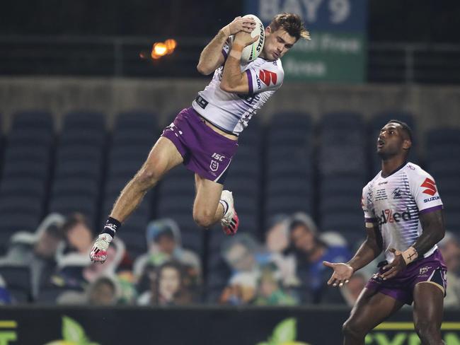 Melbourne Storm star Ryan Papenhuyzen takes a bomb during the game against the Penrith Panthers at Campbelltown Stadium in Sydney on Friday. Picture: Brett Costello