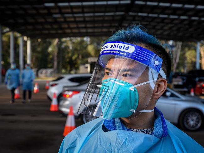 SYDNEY, AUSTRALIA - NewsWire Photos July 11, 2021: Covid testing and cars lined up at Fairfield covid drive through clinic. Picture: NCA NewsWire / Flavio Brancaleone