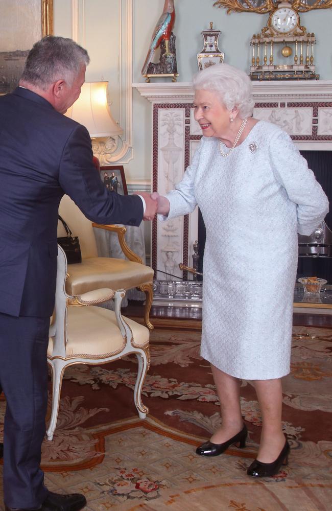 Queen Elizabeth, pictured greeting King Abdullah II of Jordan, has sparked concern over her ‘bruised’ hand. Picture: Yui Mok — WPA Pool/Getty Images