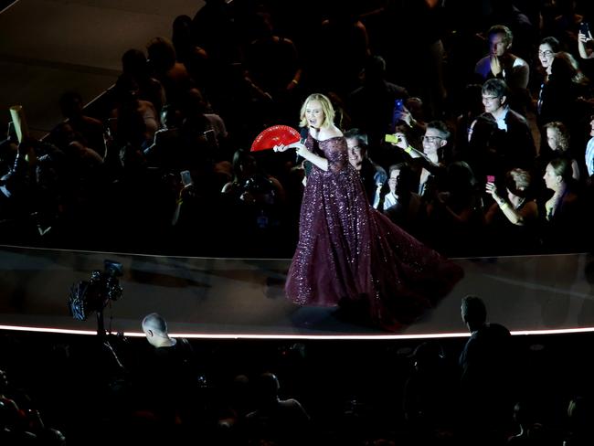 Adele tries to beat the Queensland heat as she performs at the Gabba in Brisbane. Picture: Steve Pohlner