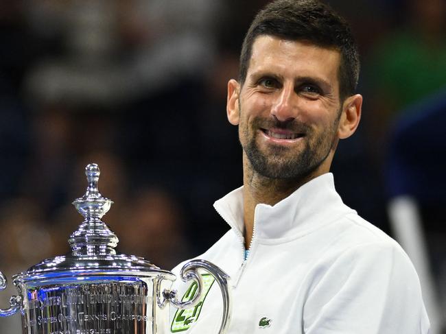 TOPSHOT - Serbia's Novak Djokovic poses with the trophy after defeating Russia's Daniil Medvedev in the US Open tennis tournament men's singles final match at the USTA Billie Jean King National Tennis Center in New York on September 10, 2023. (Photo by ANGELA WEISS / AFP)