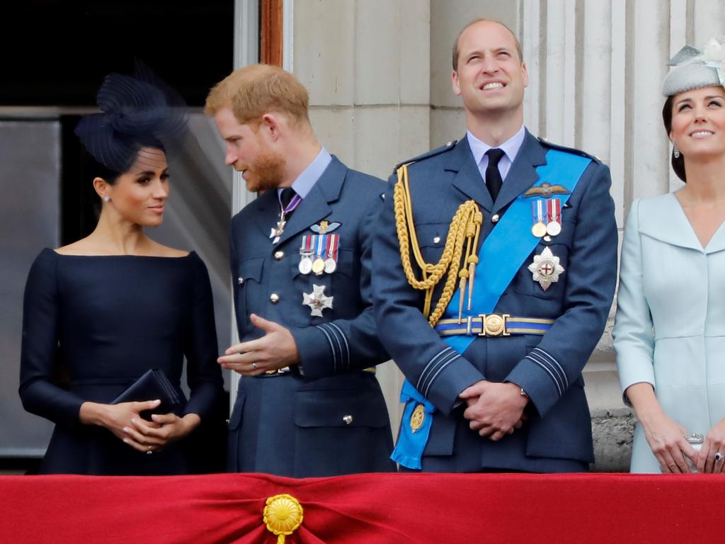 Meghan, Prince Harry, Prince William, and Kate on the balcony of Buckingham Palace, to watch a military fly-past to mark the centenary of the Royal Air Force. Picture: Tolga Akmen/AFP