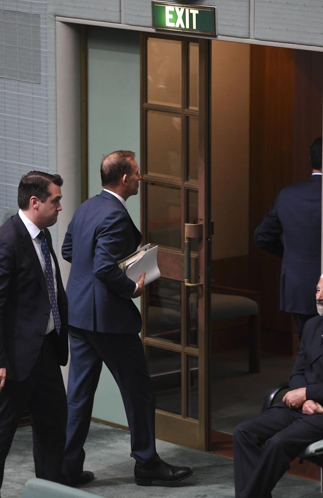 When it came time to vote, Mr Abbott headed for the exit. Picture: Lukas Coch/AAP