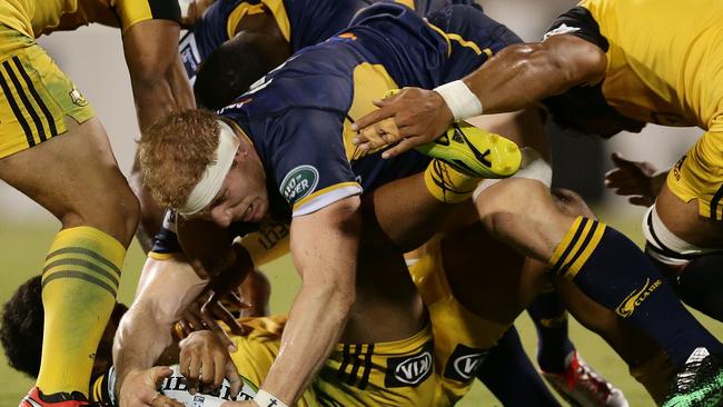 CANBERRA, AUSTRALIA - FEBRUARY 26: David Pocock of the Brumbies competes for the ball at a ruck during the round one Super Rugby match between the Brumbies and the Hurricanes at GIO Stadium on February 26, 2016 in Canberra, Australia. (Photo by Mark Metcalfe/Getty Images)