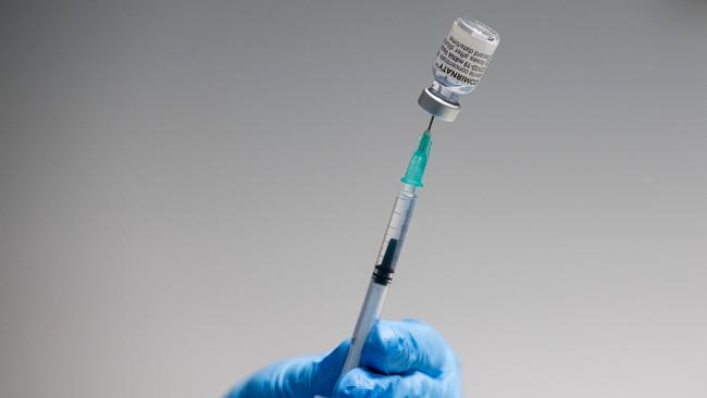 A nurse prepares a syringe that contains the Pfizer/BioNTech Covid-19 vaccine in Germany. Picture: Getty Images