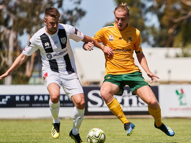 Anthony Ture and Karl Phelps at Adelaide City Football Club, in the match between Adelaide City and Cumberland Park, Saturday, Feb. 22, 2020. (AAP Image/MATT LOXTON)