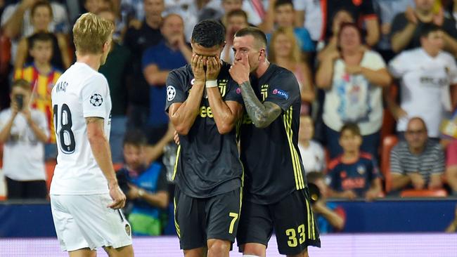 Juventus' Portuguese forward Cristiano Ronaldo (C) reacts after receiving a red card during the UEFA Champions League group H football match between Valencia CF and Juventus FC. Picture: AFP