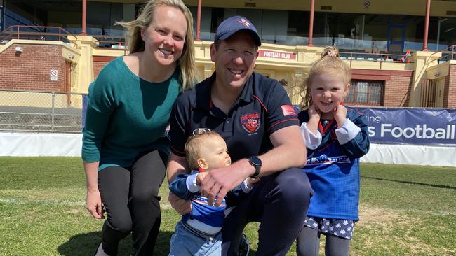 North Hobart's outgoing coach Richard Robinson with his family at yesterday's announcement – wife Heather, son Billy, 1, and daughter Rosie, 4. Pic James Bresnehan