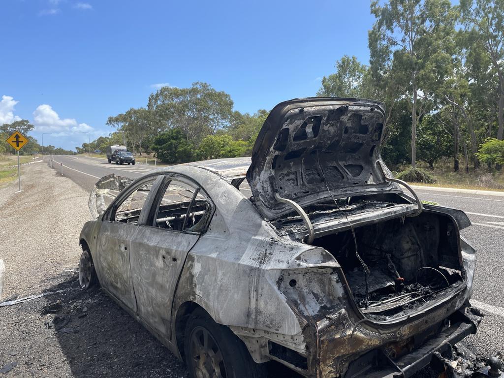 A burnt out car beside the Bruce Hwy, south of Bowen.