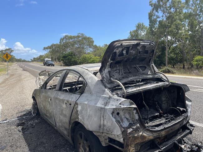 A burnt out car beside the Bruce Hwy, south of Bowen.