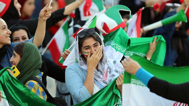 Female fans show their support at the World Cup qualifier match between Iran and Cambodia at Tehran’s Azadi Stadium on Thursday. Picture: Getty Images