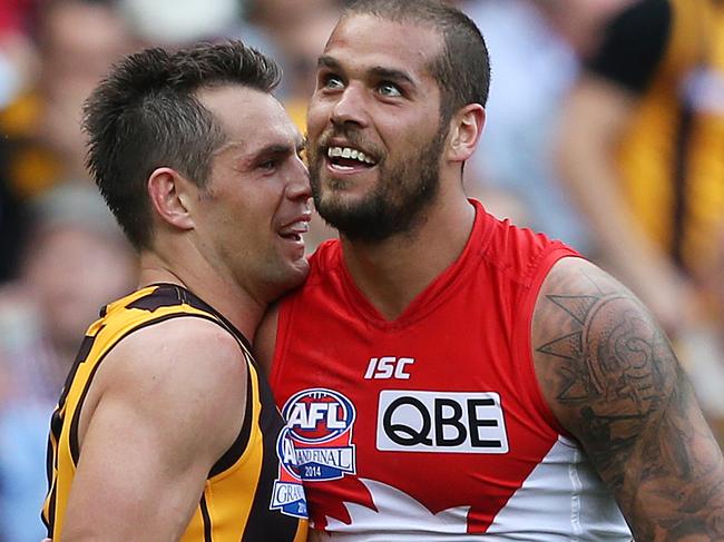 Sydney Swans' Lance Franklin has push and shove with Hawthorn's Luke Hodge during AFL Grand Final 2014 Sydney Swans v Hawthorn at the MCG. pic. Phil Hillyard