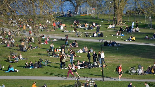 People enjoy warm and spring-like weather with high temperatures free of lockdown in Stockholm in April, 2020. Picture: Anders Wiklund/AFP