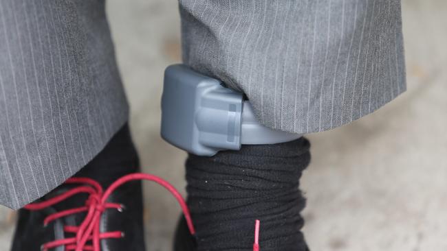 Journalist Mark Morri wearing an electronic monitoring bracelet. Fitted at Silverwater Correctional Complex and then walking around Silverwater entering a predifined restricted zone.