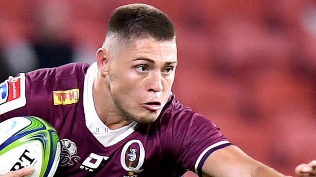 BRISBANE, AUSTRALIA - JULY 03: James O'Connor of the Reds attempts to break away from the defence during the round 1 Super Rugby AU match between the Queensland Reds and the New South Wales Waratahs at Suncorp Stadium on July 03, 2020 in Brisbane, Australia. (Photo by Bradley Kanaris/Getty Images)