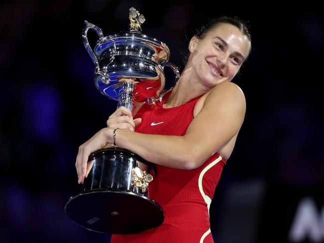 MELBOURNE, AUSTRALIA - JANUARY 27: Aryna Sabalenka poses with the Daphne Akhurst Memorial Cup after the the Women's Singles Final match between Qinwen Zheng of China and Aryna Sabalenka during the 2024 Australian Open at Melbourne Park on January 27, 2024 in Melbourne, Australia. (Photo by Cameron Spencer/Getty Images)